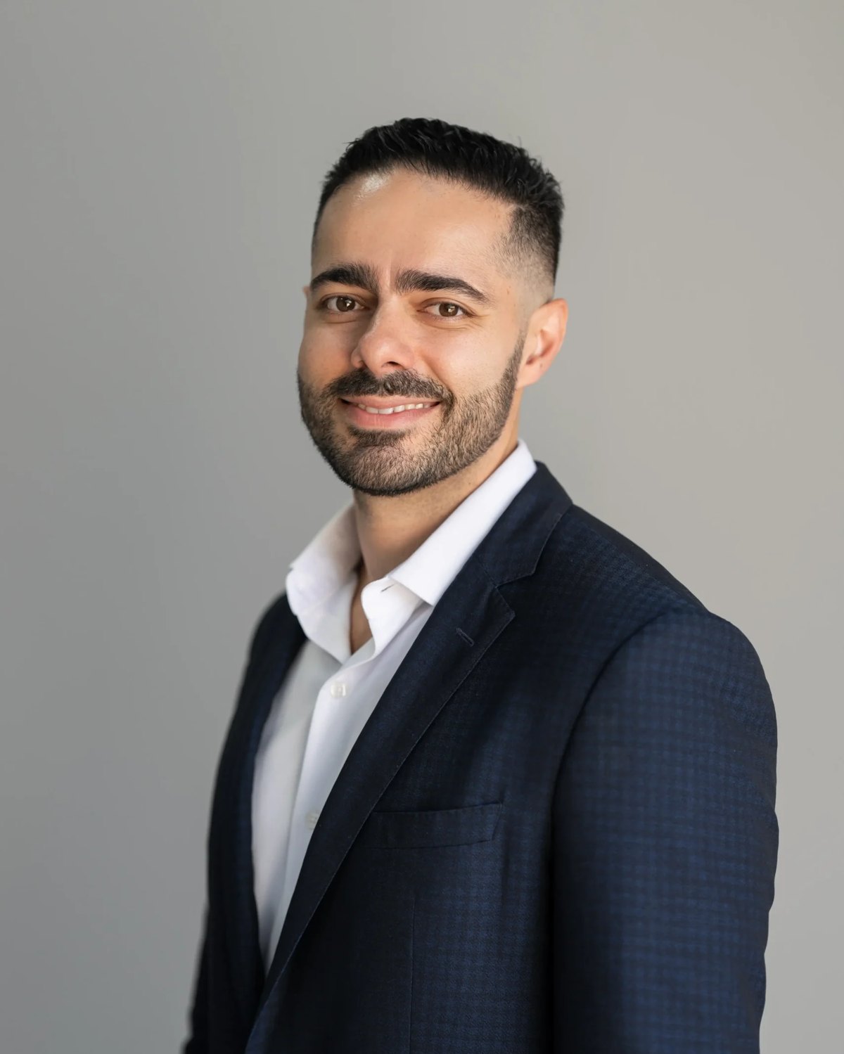 Dr. Hayk Stepanyan, orthopedic surgeon, in a navy blazer
